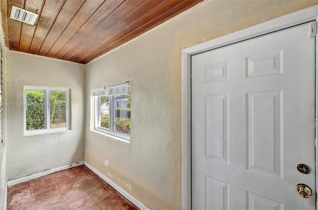 2331 NW 92nd St, Miami, FL 33147 - interior space featuring tile patterned floors, wood ceiling, baseboards, and visible vents