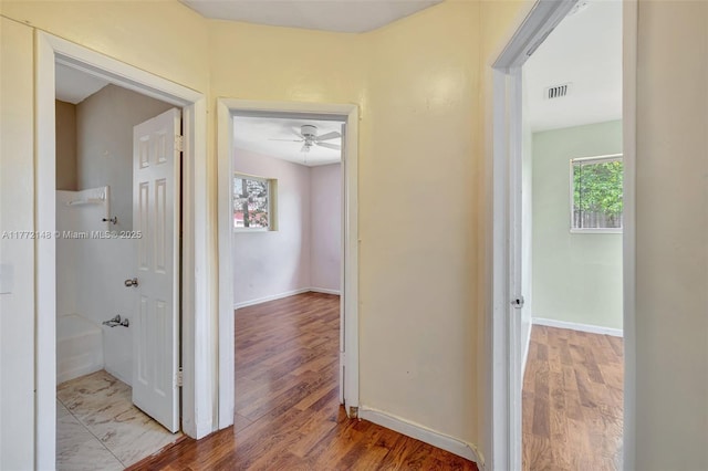 2331 NW 92nd St, Miami, FL 33147 - hall with visible vents, wood finished floors, and a healthy amount of sunlight