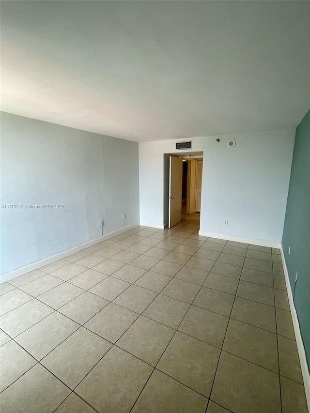 2400 SW 3rd Ave Unit 605, Miami, FL 33129 - spare room with light tile patterned floors, baseboards, and visible vents