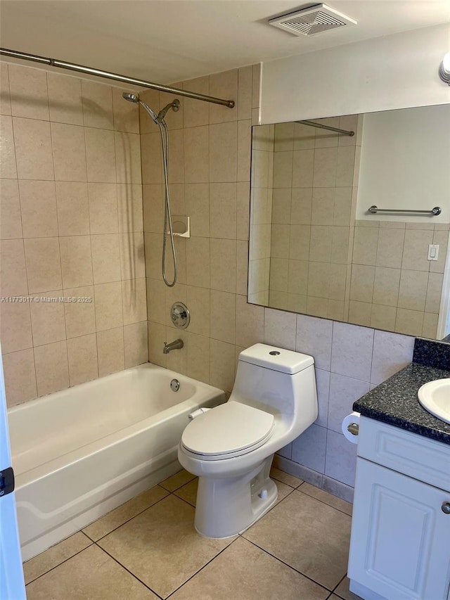 2400 SW 3rd Ave Unit 605, Miami, FL 33129 - bathroom featuring tile walls, visible vents, tile patterned floors, and shower / bath combination