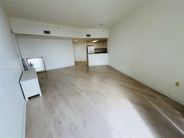 19501 W Country Club Dr Unit 1006, Aventura, FL 33180 - unfurnished living room featuring baseboards, visible vents, and light wood-type flooring