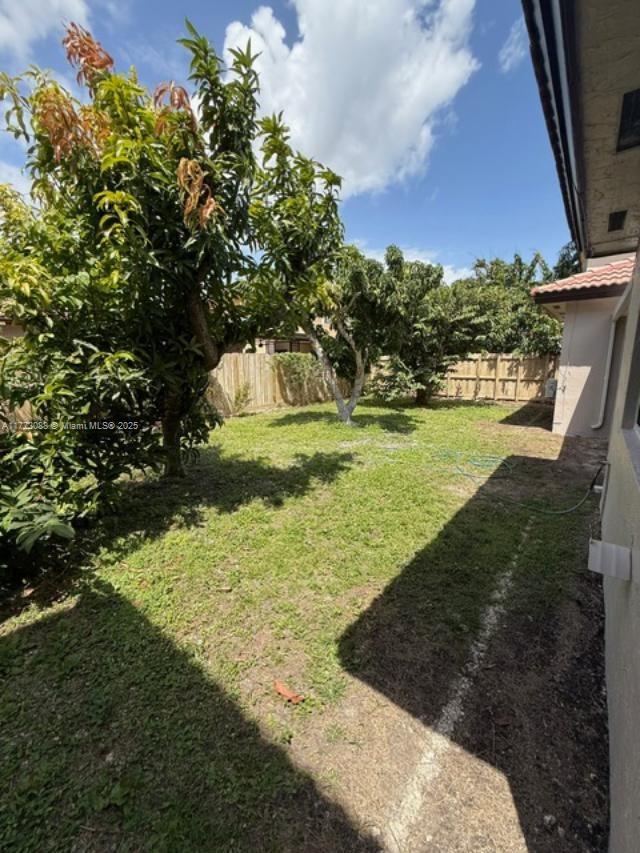 view of yard featuring fence