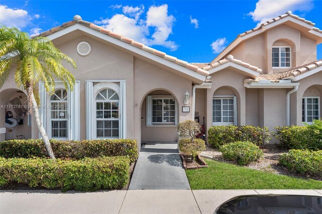 3171 Holiday Springs Blvd Unit 31-5, Margate, FL 33063 - property entrance with a tile roof and stucco siding