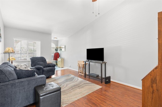 3171 Holiday Springs Blvd Unit 31-5, Margate, FL 33063 - living room featuring baseboards, ceiling fan, and wood finished floors