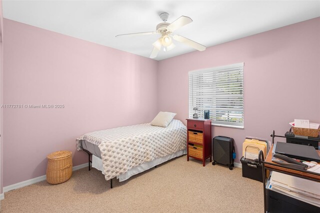 3171 Holiday Springs Blvd Unit 31-5, Margate, FL 33063 - carpeted bedroom featuring baseboards and a ceiling fan
