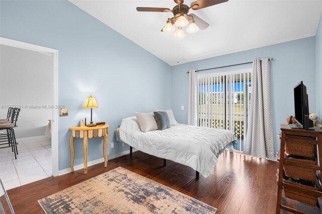 3171 Holiday Springs Blvd Unit 31-5, Margate, FL 33063 - bedroom with baseboards, lofted ceiling, wood finished floors, and access to outside
