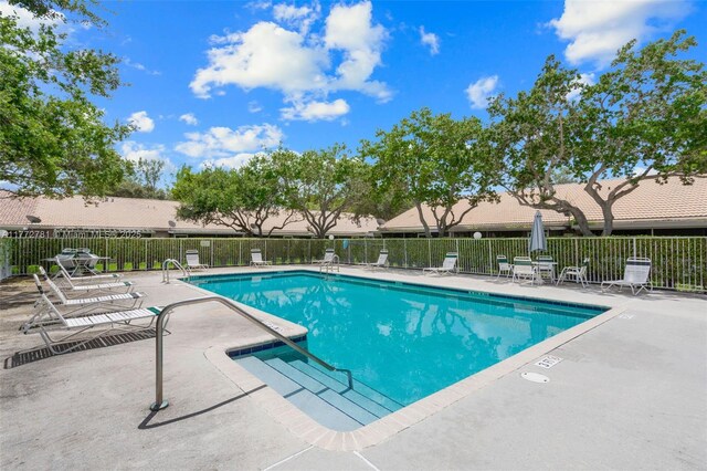 3171 Holiday Springs Blvd Unit 31-5, Margate, FL 33063 - community pool featuring fence and a patio