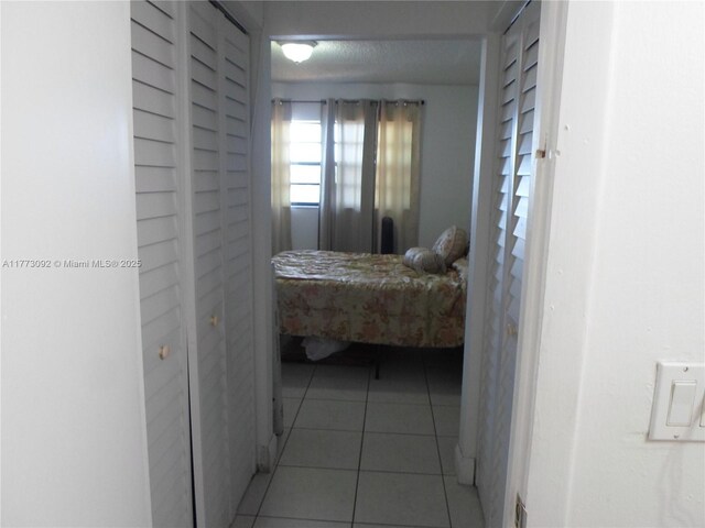 2750 W 60th St Unit 59, Hialeah, FL 33016 - bedroom featuring light tile patterned flooring