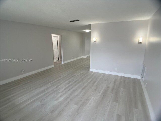 6990 NW 17th St, Margate, FL 33063 - spare room featuring light wood-style flooring, baseboards, and visible vents