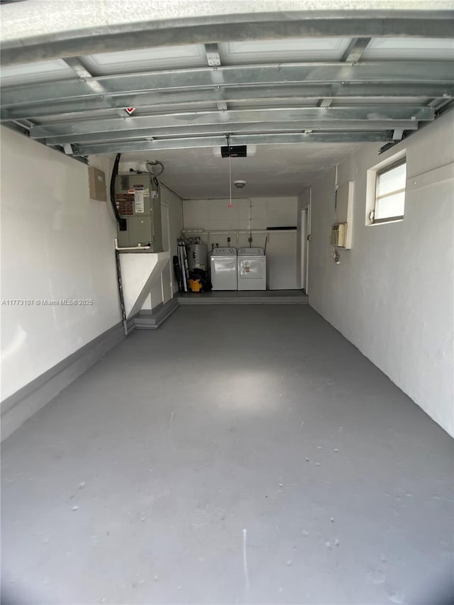 6990 NW 17th St, Margate, FL 33063 - garage with washing machine and dryer, heating unit, a garage door opener, and secured water heater