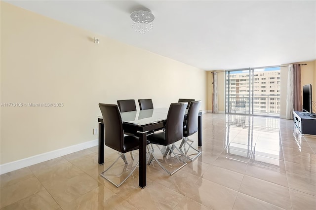 1849 S Ocean Dr Unit 711, Hallandale Beach, FL 33009 - dining space featuring expansive windows, light tile patterned floors, and baseboards