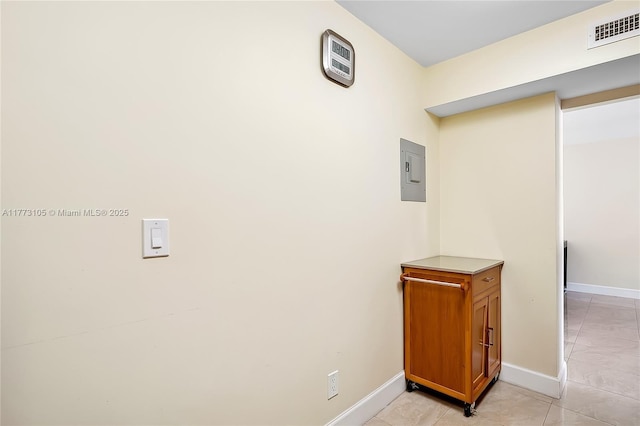 1849 S Ocean Dr Unit 711, Hallandale Beach, FL 33009 - hallway featuring baseboards, electric panel, and light tile patterned floors