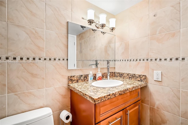 1849 S Ocean Dr Unit 711, Hallandale Beach, FL 33009 - bathroom with tile walls, vanity, toilet, and backsplash