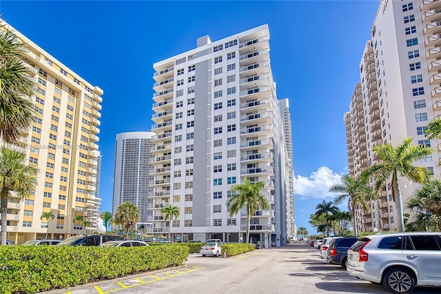 1849 S Ocean Dr Unit 711, Hallandale Beach, FL 33009 - view of building exterior featuring uncovered parking and a view of city