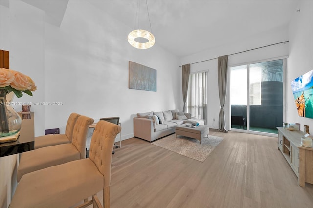 244 Biscayne Blvd Unit 206, Miami, FL 33132 - living area featuring light wood finished floors and a towering ceiling