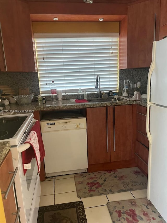 1100 Colony Point Cir Unit 201, Pembroke Pines, FL 33026 - kitchen with white appliances, a sink, backsplash, light tile patterned floors, and dark stone countertops