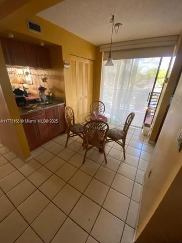 1100 Colony Point Cir Unit 201, Pembroke Pines, FL 33026 - dining space featuring light tile patterned floors