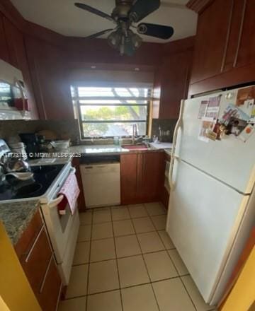 1100 Colony Point Cir Unit 201, Pembroke Pines, FL 33026 - kitchen featuring white appliances, light tile patterned flooring, a ceiling fan, and a sink