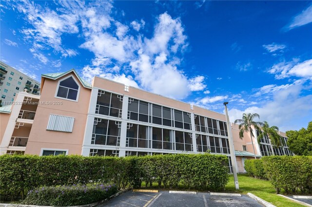 85 Gulfstream Rd Unit 304A, Dania Beach, FL 33004 - view of apartment building / complex with uncovered parking