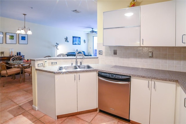 85 Gulfstream Rd Unit 304A, Dania Beach, FL 33004 - kitchen with stainless steel dishwasher, a sink, a peninsula, and backsplash