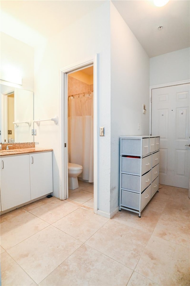 85 Gulfstream Rd Unit 304A, Dania Beach, FL 33004 - bathroom with vanity, tile patterned floors, toilet, and baseboards