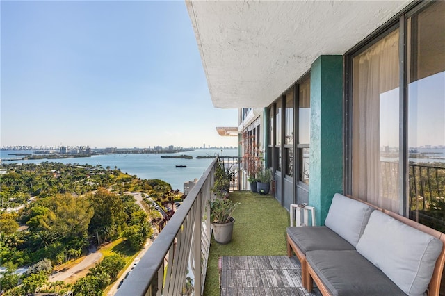balcony featuring a water view