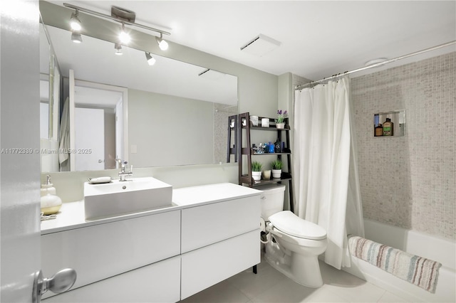 full bath with toilet, tile patterned floors, shower / bath combo with shower curtain, and vanity