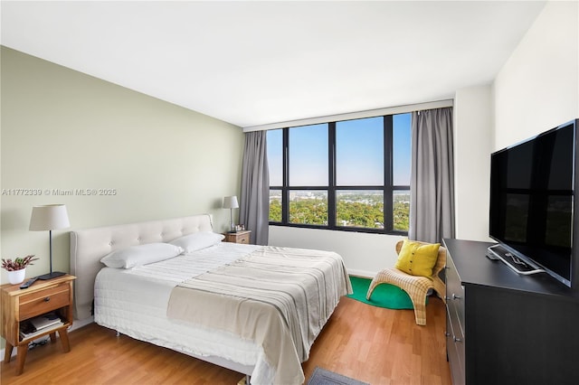 bedroom featuring light wood-style floors