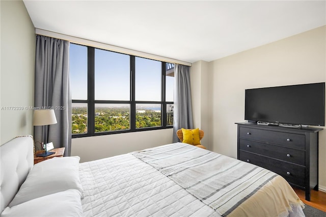 bedroom with wood finished floors