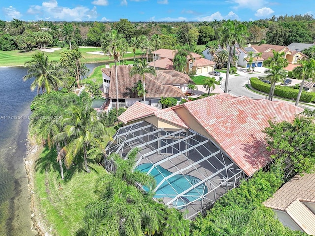 birds eye view of property with a water view and a residential view