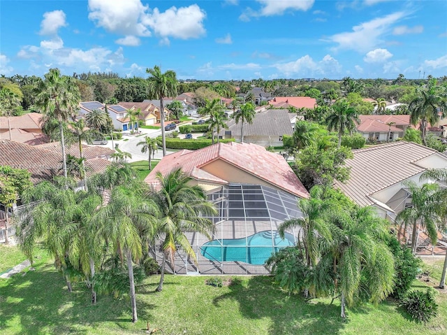 birds eye view of property with a residential view