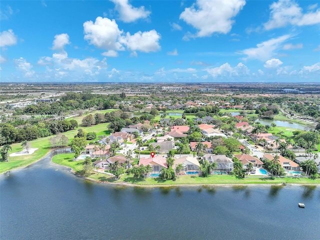 birds eye view of property featuring a water view and a residential view