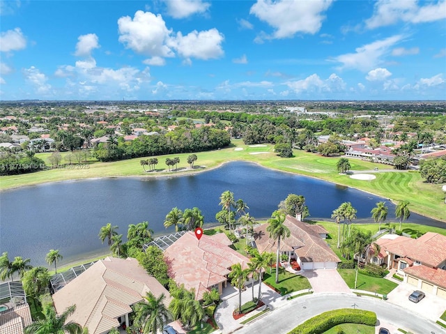 birds eye view of property featuring view of golf course, a residential view, and a water view