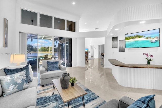 living room with recessed lighting and light tile patterned floors