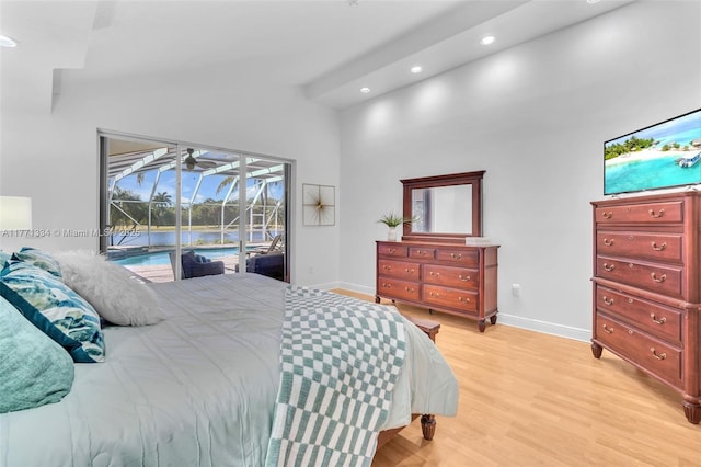 bedroom featuring a high ceiling, access to outside, light wood-style flooring, baseboards, and recessed lighting