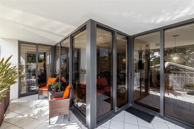 exterior space featuring tile patterned floors and floor to ceiling windows