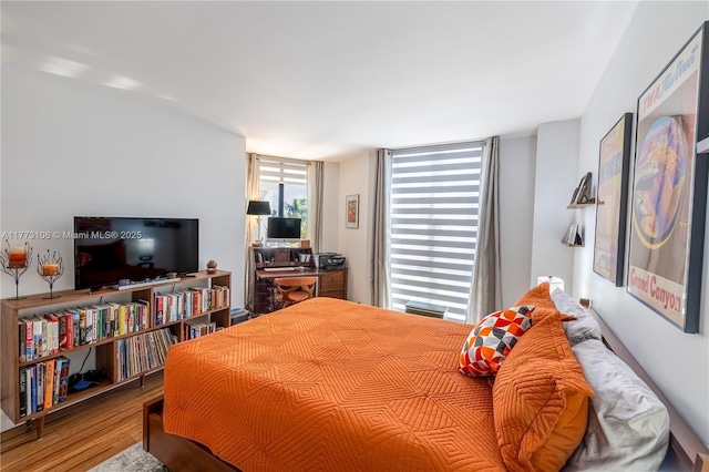 bedroom featuring wood finished floors