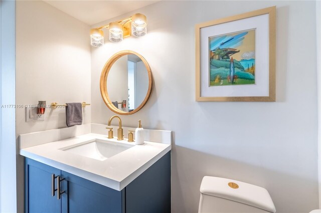 bathroom with toilet and vanity