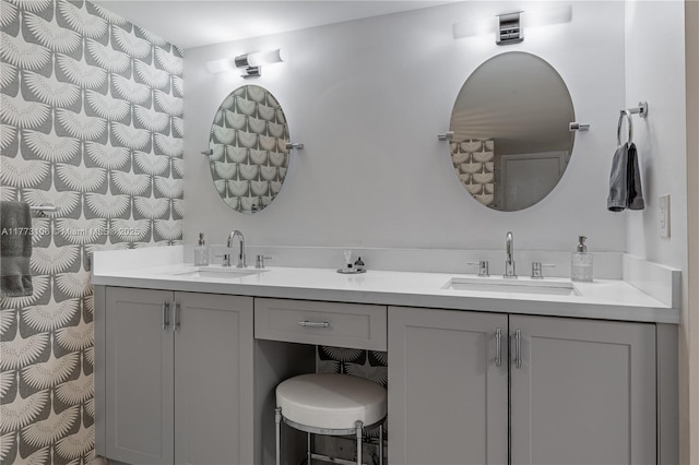 bathroom with double vanity and a sink
