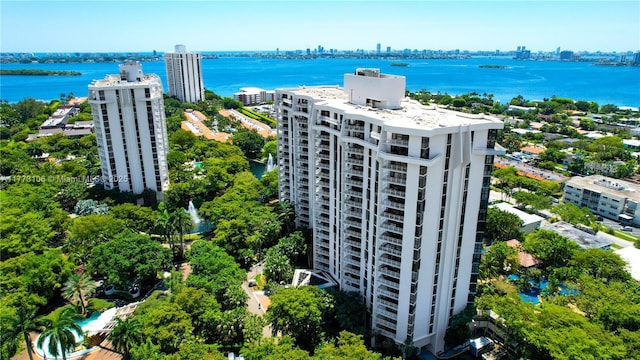drone / aerial view featuring a water view and a view of city