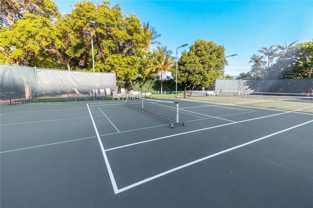 view of sport court with fence