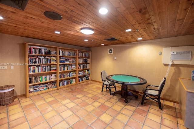 rec room with light tile patterned floors, wooden ceiling, an AC wall unit, and recessed lighting