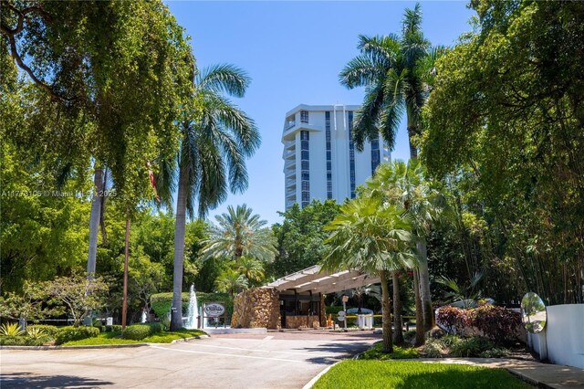 view of community with uncovered parking