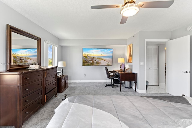 5876 Regal Glen Dr Unit 101, Boynton Beach, FL 33437 - bedroom with light colored carpet, baseboards, a ceiling fan, and a textured ceiling