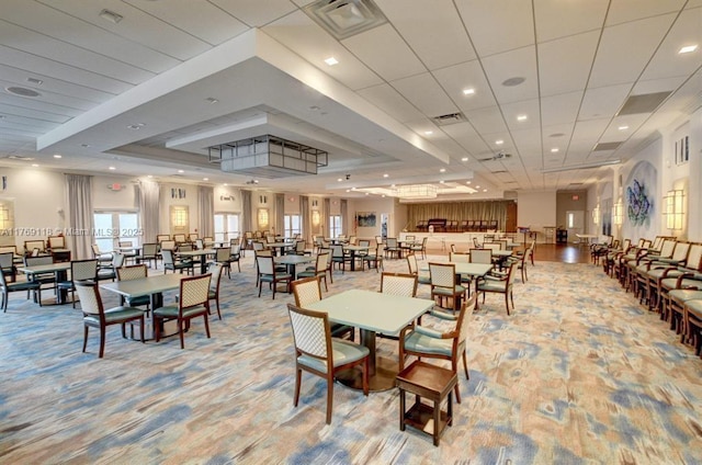 5876 Regal Glen Dr Unit 101, Boynton Beach, FL 33437 - dining area featuring visible vents, light carpet, and a tray ceiling
