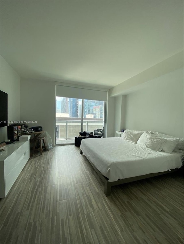 55 SE 6th St Unit 1506, Miami, FL 33131 - bedroom with dark wood finished floors