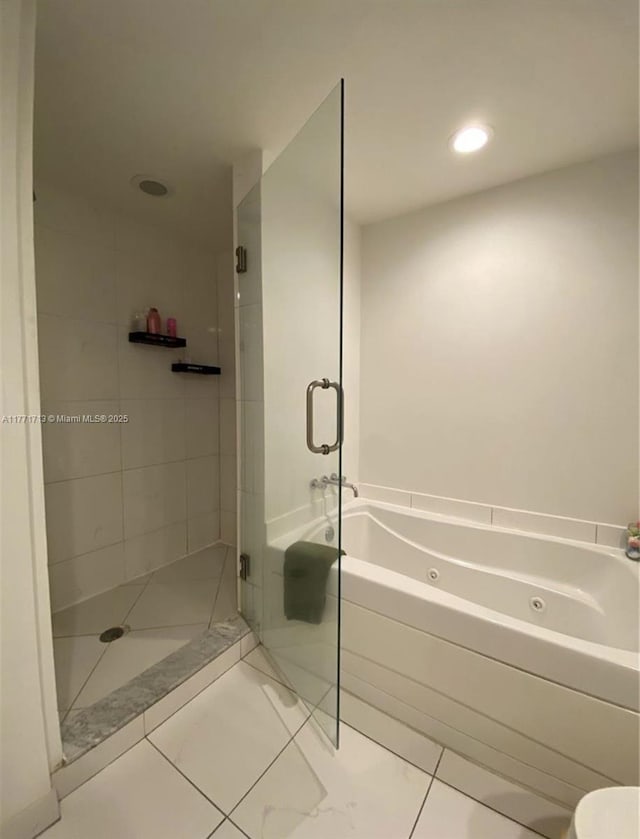 55 SE 6th St Unit 1506, Miami, FL 33131 - bathroom featuring a shower stall, a tub with jets, and recessed lighting