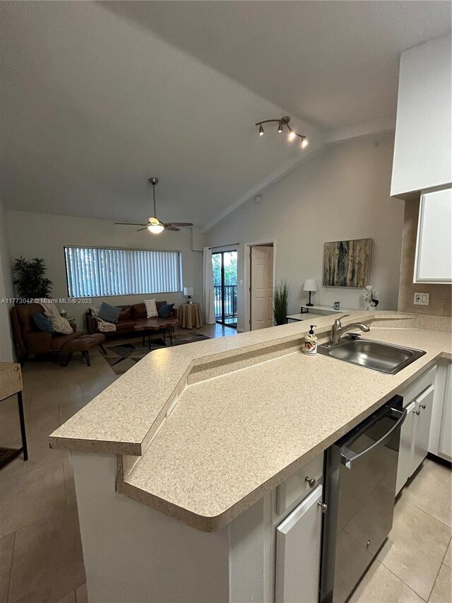 2445 SW 18th Ter Unit 1119, Fort Lauderdale, FL 33315 - kitchen featuring dishwasher, a sink, light countertops, a peninsula, and white cabinetry