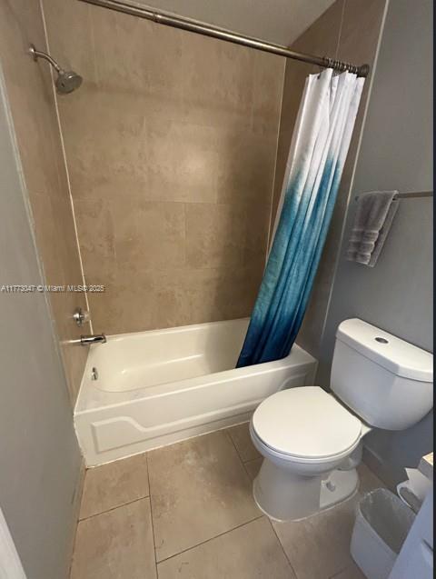 2445 SW 18th Ter Unit 1119, Fort Lauderdale, FL 33315 - bathroom featuring shower / bath combo, toilet, and tile patterned flooring
