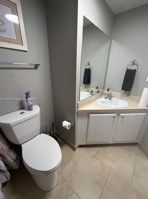 2445 SW 18th Ter Unit 1119, Fort Lauderdale, FL 33315 - bathroom featuring toilet, tile patterned floors, and vanity